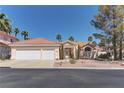 Charming single-story home with a two-car garage and well-manicured landscaping at 8300 Slate Harbor Cir, Las Vegas, NV 89128
