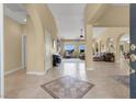 Inviting foyer with tile flooring leads to open living spaces filled with natural light at 8608 Willow Cabin St, Las Vegas, NV 89131