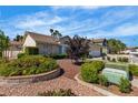 Well-maintained front yard with lush landscaping and a charming exterior at 8761 Anchor Point Ave, Las Vegas, NV 89117