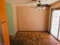 Dining room with ceiling fan and light, and brown-tiled flooring in a single Gathering home at 8813 Pavia Dr, Las Vegas, NV 89117