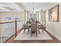 Elegant dining room with contemporary furnishings and plenty of natural light at 1 Corte Belleza, Henderson, NV 89011