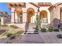Inviting home entrance with landscaped yard and decorative archways at 1 Corte Belleza, Henderson, NV 89011