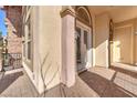 Charming patio with brick flooring, neutral stucco walls, and French doors at 1 Corte Belleza, Henderson, NV 89011