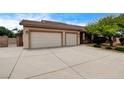 Spacious three-car garage and extended driveway offer plenty of parking at 12780 Davis Wright Ct, Henderson, NV 89044