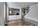 Open living room featuring hardwood floors, a fireplace, and an open floor plan at 189 Regal Sunset Ave, Henderson, NV 89002