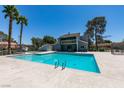 Community pool featuring clear blue water and palm trees in the background at 2454 Paradise Village Way, Las Vegas, NV 89120
