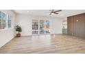 Open-concept living area with new floors, modern fixtures, and ample natural light at 2559 Winterwood Blvd, Las Vegas, NV 89142