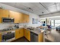 Contemporary kitchen showcases stainless appliances, granite counters, and an open design at 353 E Bonneville Ave # 555, Las Vegas, NV 89101