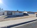 Exterior shot showcasing a single-story home with a low-pitched roof, a small yard, and desert landscaping at 4321 El Conlon Ave, Las Vegas, NV 89102