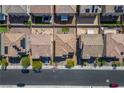 Aerial view of residential homes with well-maintained yards and tiled roofs, showcasing neighborhood layout at 4634 Observed St, North Las Vegas, NV 89031