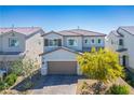 A beautiful two-story home with a welcoming facade, manicured landscaping, and a spacious two-car garage at 4634 Observed St, North Las Vegas, NV 89031