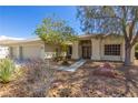 Beautiful single-story home with a well-maintained yard, mature trees, and a double-door entryway at 6908 Bienville St, Las Vegas, NV 89131