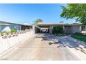 View of the exterior showing the carport and long driveway at 7 Sturm St, Henderson, NV 89015