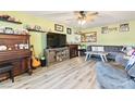 View of the living room with hardwood floors and ceiling fan at 7 Sturm St, Henderson, NV 89015