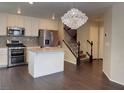 A modern kitchen features stainless steel appliances and a center island at 7257 Early Pioneer Ave, Las Vegas, NV 89129