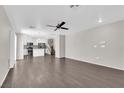 Spacious living room with modern wood-look flooring and ample natural light at 7257 Early Pioneer Ave, Las Vegas, NV 89129