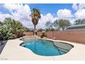 Inviting backyard pool featuring a spa and lush landscaping for relaxation at 7870 Midnight Ride St, Las Vegas, NV 89131