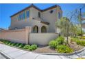 Beautifully landscaped exterior with a private courtyard and charming architectural details with covered porch entry at 8958 Howell St, Las Vegas, NV 89166