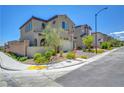 Inviting curb appeal with manicured landscaping and a charming exterior, complete with a private courtyard entry at 8958 Howell St, Las Vegas, NV 89166