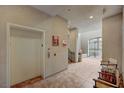 Building lobby area with elevator, seating, and decorative elements at 9201 Tesoras Dr # 401, Las Vegas, NV 89144