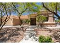 Charming single-story home with a well-manicured front yard and a tiled roof at 9800 Rosamond Dr, Las Vegas, NV 89134