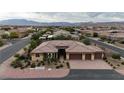 Stunning aerial shot of a single-Gathering home highlighting the tile roof, lush landscaping, and mountain views at , Las Vegas, NV 89113
