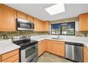 Bright kitchen featuring stainless steel appliances and tile backsplash at 101 Luna Way # 222, Las Vegas, NV 89145