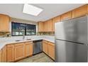 Bright kitchen featuring stainless steel appliances and wood cabinets at 101 Luna Way # 222, Las Vegas, NV 89145
