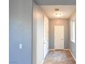 Bright hallway with tile floors, neutral paint, and direct access to other rooms at 11416 Belmont Lake Dr # 102, Las Vegas, NV 89135