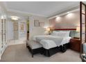 Spacious bedroom with a king-size bed, ensuite bathroom, and comfortable seating at 145 E Harmon Ave # 409, Las Vegas, NV 89109