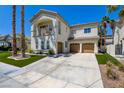 Beautiful two-story stucco home with three-car garage, desert landscaping, and balcony at 153 Cascade Lake St, Las Vegas, NV 89148