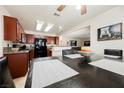 Modern kitchen boasting dark wood cabinetry, sleek black appliances, and an open layout at 2008 Spruce Brook Dr, Henderson, NV 89074