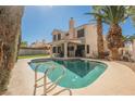 Private backyard oasis with a sparkling pool and lush green landscaping, ideal for relaxation at 2008 Spruce Brook Dr, Henderson, NV 89074