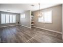 Bright living room with hardwood floors, recessed lighting, and stylish light fixture at 2166 Sleepy Ct, Las Vegas, NV 89106