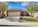 Beautiful single-story home with a two-car garage and desert landscaping, offering serene outdoor living at 2485 Jade Sky St, Henderson, NV 89044