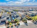 New construction homes feature pools, landscaping, and solar panels in a vibrant community with mountain views at 2637 Via Monet, Henderson, NV 89044
