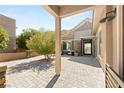 Attractive home featuring a covered entryway and a brick driveway at 2927 The Peaks Ln, Las Vegas, NV 89138