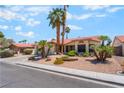 Inviting single-story home with drought-resistant landscaping and a terracotta tile roof at 3108 Leafwood St, Las Vegas, NV 89108