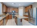 A modern kitchen with stainless steel appliances, granite countertops, and lots of cabinet space at 3440 Bella Viera Ct, Las Vegas, NV 89141