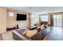 Spacious living room with lots of natural light, hardwood floors, and a comfortable seating area at 3440 Bella Viera Ct, Las Vegas, NV 89141