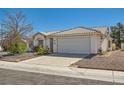 Charming single-story home with a two-car garage and desert landscaping at 3912 Branchwood Dr, North Las Vegas, NV 89032