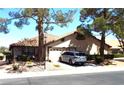 Charming single-story home featuring a tile roof, well maintained landscaping and two-car garage at 3954 Saddlewood Ct, Las Vegas, NV 89121