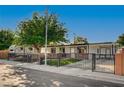 Single story home featuring RV parking, secure fencing, and xeriscaped yard at 4284 Parkdale Ave, Las Vegas, NV 89121