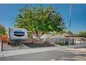 Charming single story home with secure metal fencing and large shade tree at 4284 Parkdale Ave, Las Vegas, NV 89121