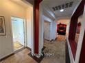 Hallway with doors to bedrooms and bathrooms, featuring modern paint and design at 5019 Quiet Falls Ct, Las Vegas, NV 89141