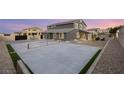 A backyard with a patio and tennis court, offering a perfect space for outdoor activities at 5449 Hickory Tree St, Las Vegas, NV 89149