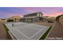 Spacious backyard featuring a pickleball court, patio and gravel landscaping at 5449 Hickory Tree St, Las Vegas, NV 89149