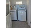 A utilitarian laundry room is shown with a newer washer and dryer set at 626 Kimberly Ave, Pahrump, NV 89060