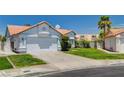 Charming single story home with well manicured lawn, desert landscaping and two car garage at 6432 Jean Lee Dr, Las Vegas, NV 89108