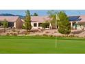Views of back of home with golf course; serene spot for relaxing and enjoying the outdoors at 7509 Chaffinch St, North Las Vegas, NV 89084